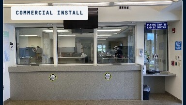 BallistiMAX reception lobby install, Tamarac, FL — transaction-window glazing at the front-of-house counter.